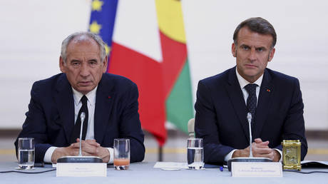 FILE PHOTO: French Prime Minister Francois Bayrou and French President Emmanuel Macron.
