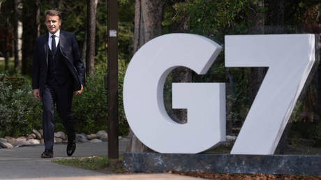 FILE PHOTO: French President Emmanuel Macron arrives at the G7 Leaders Summit on June 15, 2025 in Kananaskis, Canada.
