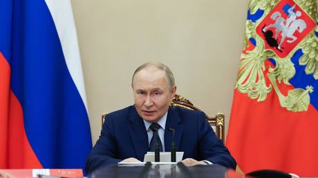 Russian President Vladimir Putin chairs a meeting with members of the Security Council at the Kremlin in Moscow, Russia.