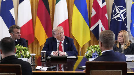 FILE PHOTO: US President Donald Trump speaks as France's President Emmanuel Macron, left, and Italy's Prime Minister Giorgia Meloni, right, listen during a meeting with Vladimir Zelensky and European leaders in the East Room of the White House, August 18, 2025, in Washington.