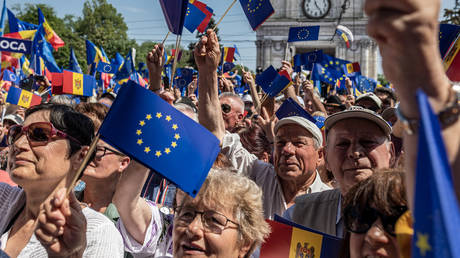 FILE PHOTO. Moldovan citizens with Moldovan and EU flags rally for their desire to join the European Union in Chisinau, Moldova, 21 May 2023.
