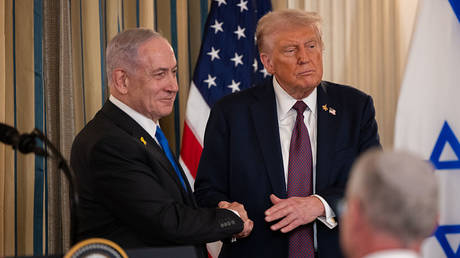 US President Donald Trump shakes hands with Israeli Prime Minister Benjamin Netanyahu after a press conference in Washington, DC, September 29, 2025.