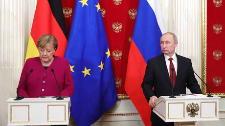 FILE PHOTO: Russian President Vladimir Putin and German Chancellor Angela Merkel holding a joint press conference in Moscow in 2020.