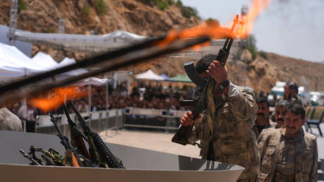 The first group of the Kurdistan Workers' Party (PKK), which is listed as a terrorist organization by Turkiye, the US and the EU, lays down and destroys their weapons in Sulaymaniyah, northern Iraq on July 11, 2025.