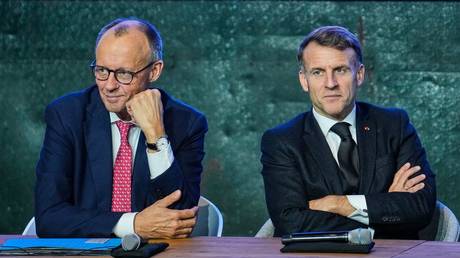 FILE PHOTO: German Chancellor Friedrich Merz (L) and French President Emmanuel Macron (R).