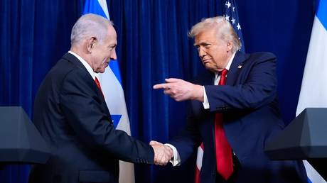 President Donald Trump shakes hands with Israel's Prime Minister Benjamin Netanyahu, December 29, 2025