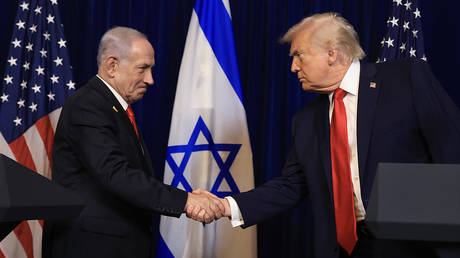 US President Donald Trump shakes hands with Israeli Prime Minister Benjamin Netanyahu during a press conference at his Mar-a-Lago club on December 29, 2025 in Palm Beach, Florida.